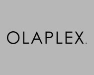 Grauer Hintergrund mit schwarzem Schriftzug „OLAPLEX.“ als Logo der Marke.